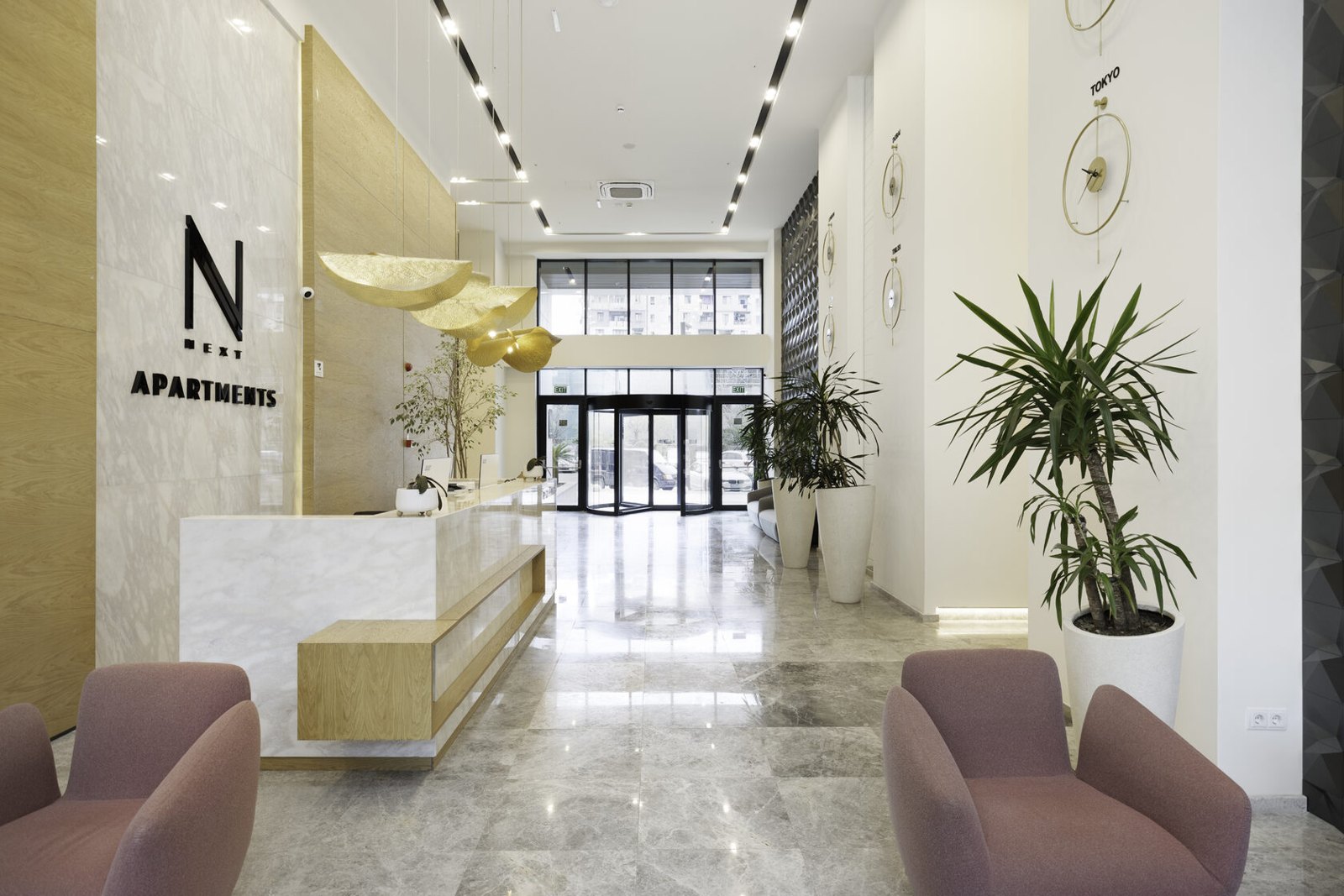 NEXT Apartments: Completed NEXT Apartments reception lobby with marble finishes and lounge seating