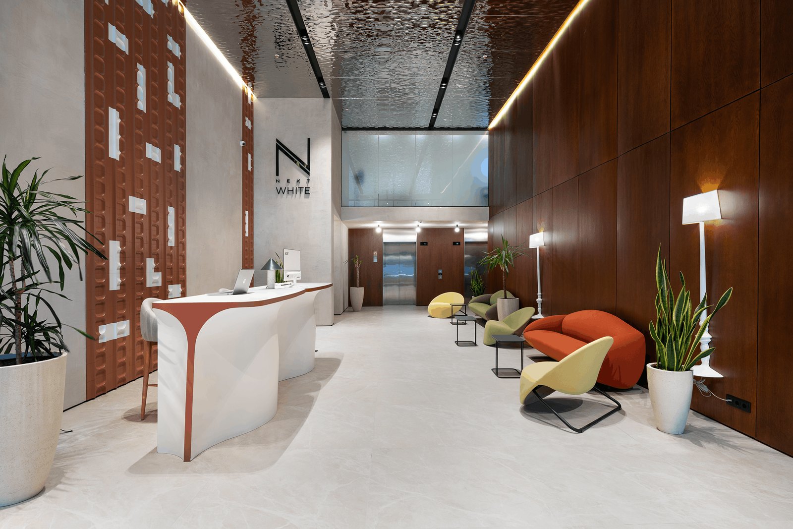 NEXT White: Completed NEXT White lobby with sculptural reception desk and colourful lounge seating