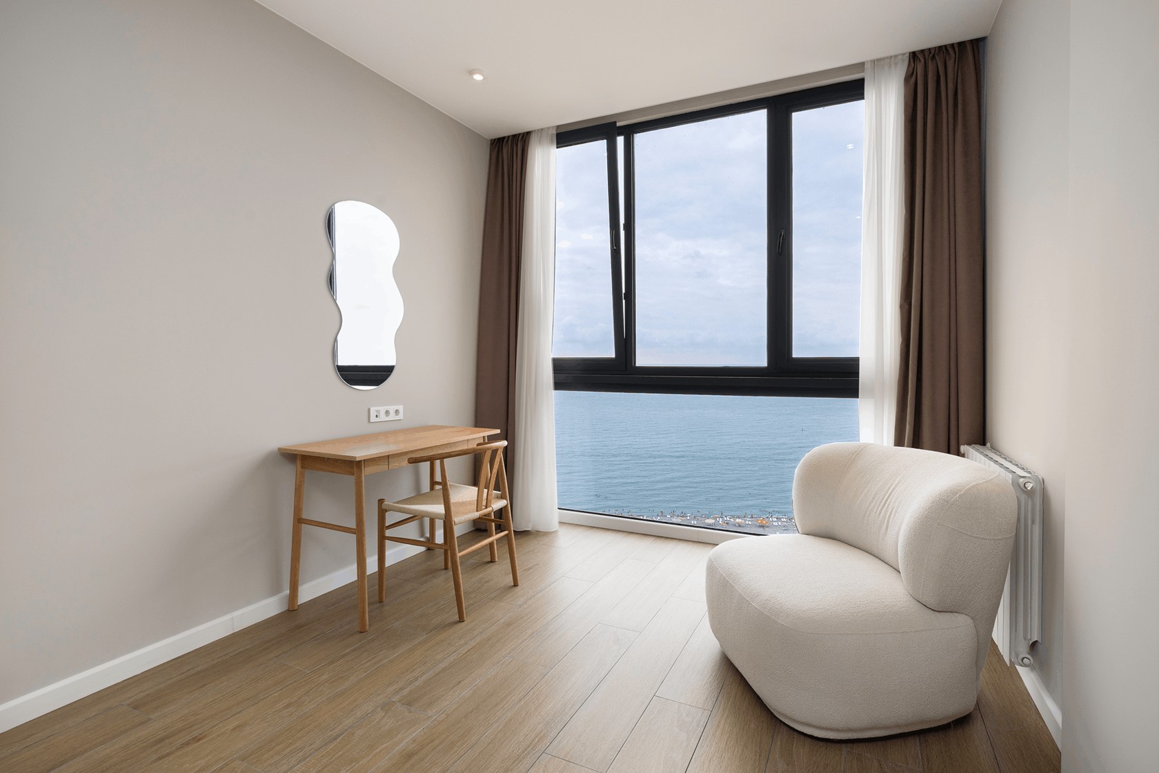 NEXT White window-side seating and sea outlook