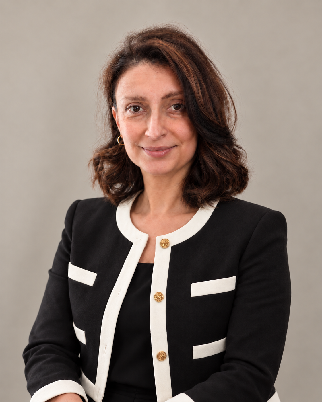 Sofio Chelidze, Chief Executive Officer of NEXT, wearing a black suit with white trim and black blouse; digitally styled for this presentation
